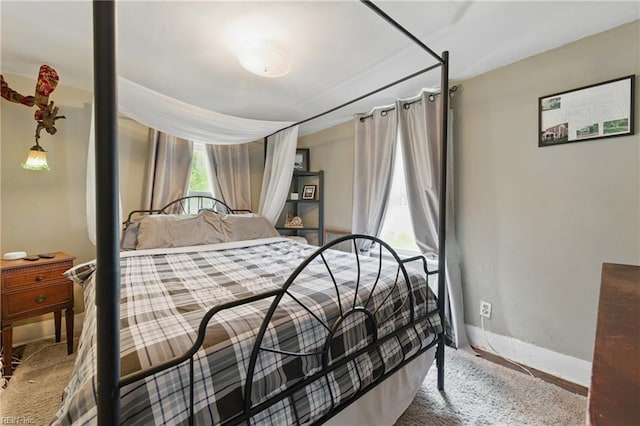 bedroom featuring baseboards