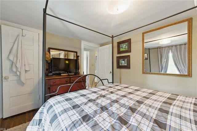 bedroom featuring wood finished floors