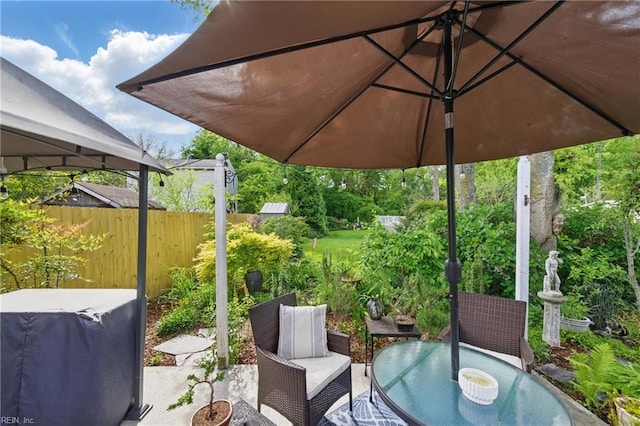view of patio / terrace featuring fence and outdoor dining space