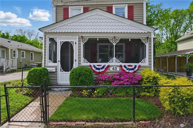 view of front of house featuring a gate and a fenced front yard