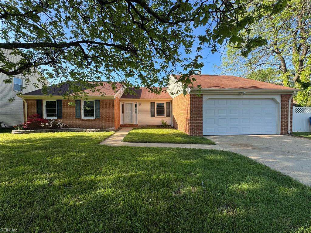 901 Woodmark Ct, Virginia Beach, VA 23452 - ranch-style home featuring brick siding, a front lawn, driveway, and an attached garage