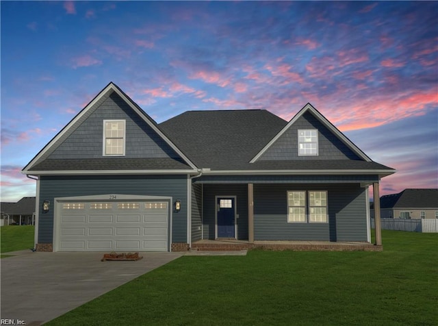 view of front of property featuring a porch, a lawn, concrete driveway, an attached garage, and fence
