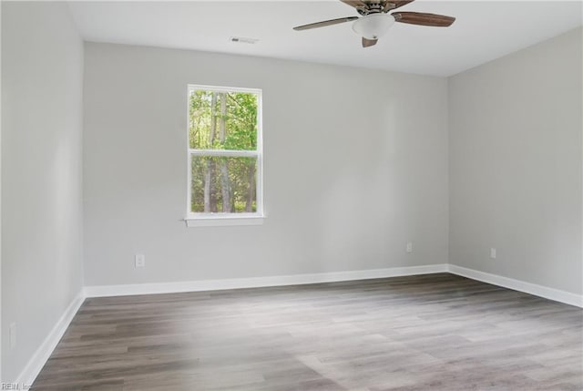 1612 Nansemond Pkwy, Suffolk, VA 23434 - empty room featuring a ceiling fan, wood finished floors, and baseboards