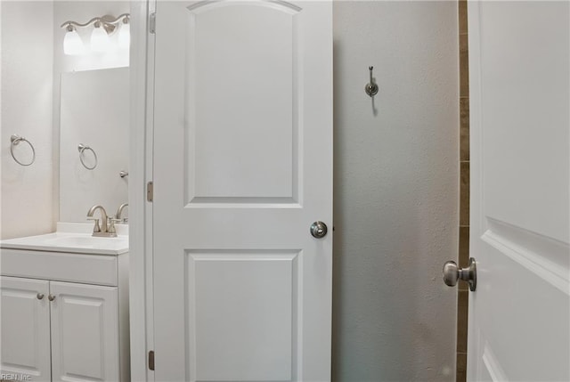 1612 Nansemond Pkwy, Suffolk, VA 23434 - bathroom with a textured wall and vanity