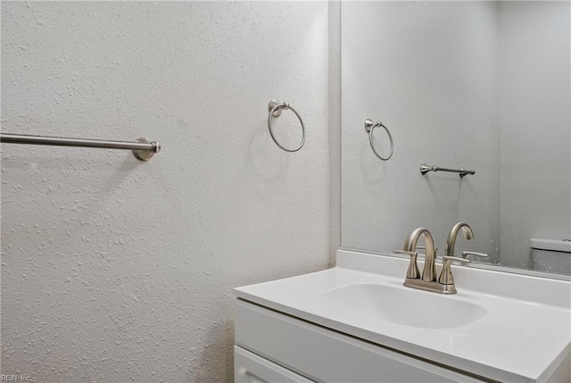 1612 Nansemond Pkwy, Suffolk, VA 23434 - bathroom with a textured wall and vanity