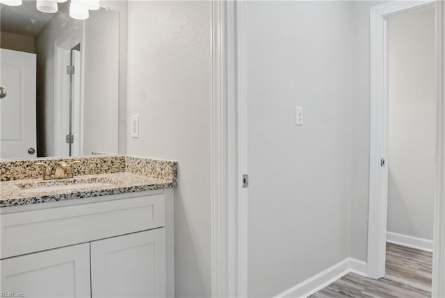 1612 Nansemond Pkwy, Suffolk, VA 23434 - bathroom with wood finished floors, vanity, and baseboards