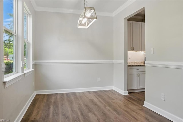 1612 Nansemond Pkwy, Suffolk, VA 23434 - unfurnished dining area featuring crown molding, baseboards, wood finished floors, and a healthy amount of sunlight