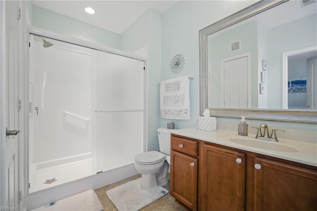 full bathroom featuring visible vents, tile patterned flooring, a stall shower, vanity, and toilet