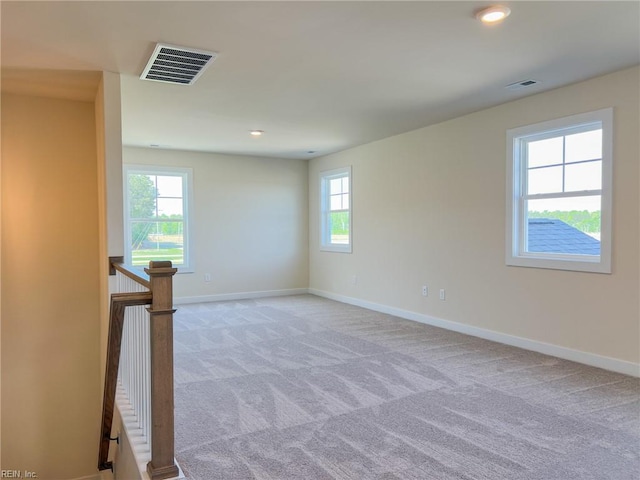 150 Mcpherson Rd, South Mills, NC 27976 - empty room with baseboards, visible vents, light carpet, and a wealth of natural light