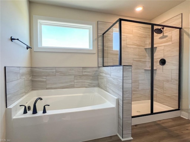 150 Mcpherson Rd, South Mills, NC 27976 - full bathroom featuring a bath, wood finished floors, and a stall shower