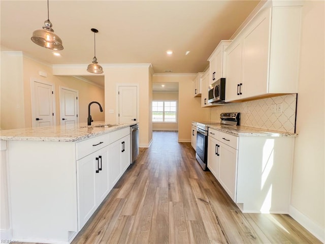 150 Mcpherson Rd, South Mills, NC 27976 - kitchen with appliances with stainless steel finishes, white cabinets, a sink, baseboards, and light wood-type flooring