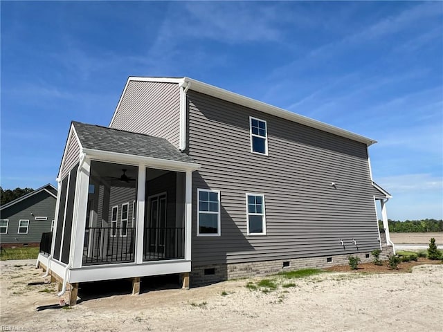 150 Mcpherson Rd, South Mills, NC 27976 - view of side of home with roof with shingles, a ceiling fan, crawl space, and a sunroom