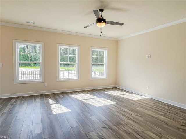 150 Mcpherson Rd, South Mills, NC 27976 - spare room with ornamental molding, dark wood-style floors, visible vents, and baseboards