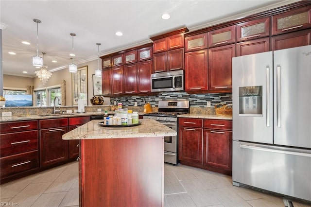 605 Maycox Ave, Norfolk, VA 23505 - kitchen with a sink, stainless steel appliances, dark brown cabinets, a kitchen island, and backsplash