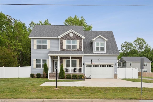 view of front of home with driveway, a front yard, an attached garage, fence, and a porch