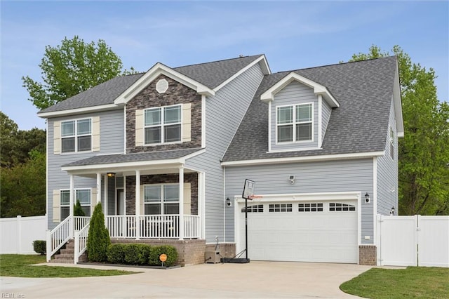 craftsman-style house featuring driveway, fence, covered porch, and a gate