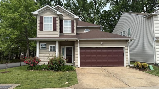 traditional-style home featuring a front lawn, concrete driveway, and an attached garage