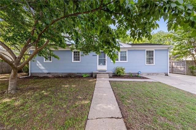 single story home featuring a front yard, crawl space, and fence
