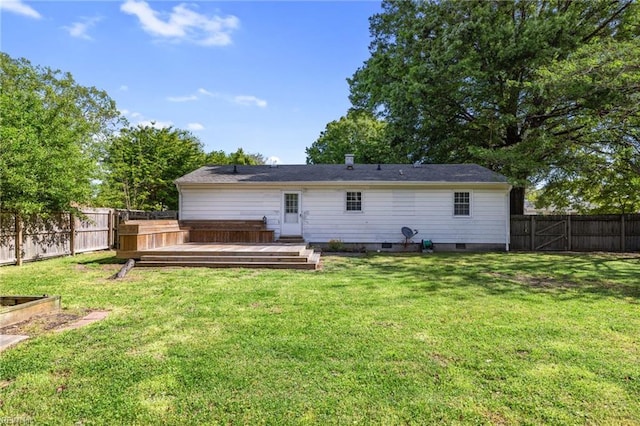 back of house featuring a lawn, a fenced backyard, a wooden deck, and crawl space