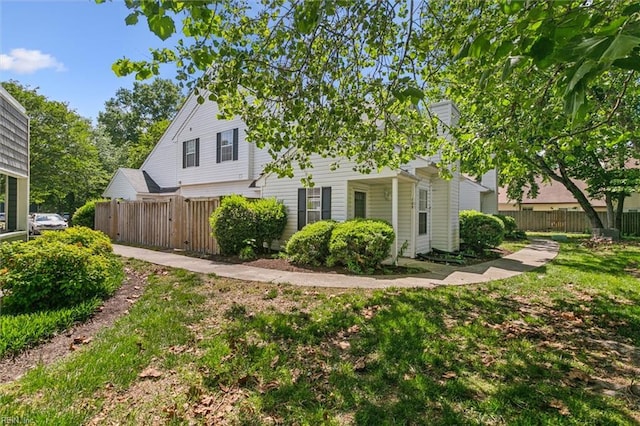 view of property exterior with fence