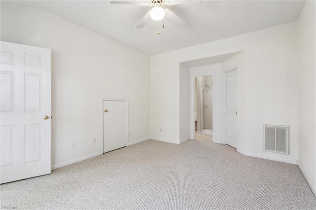 carpeted spare room with baseboards and ceiling fan