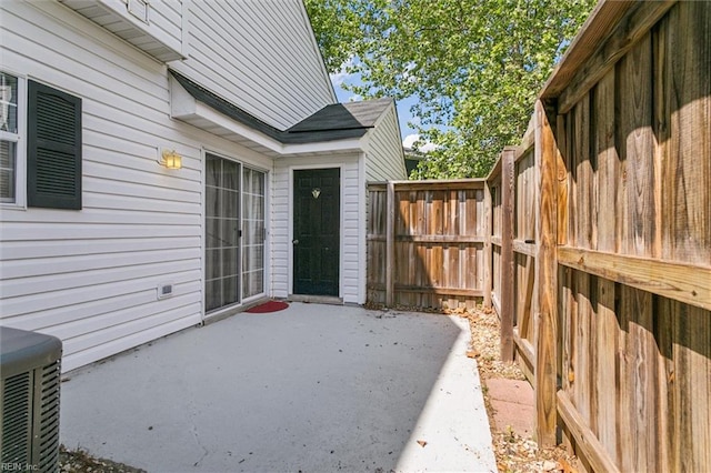 view of patio / terrace featuring fence and cooling unit