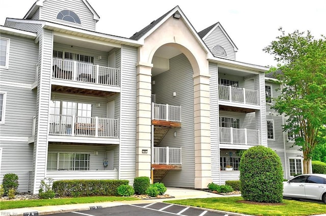 view of property with uncovered parking
