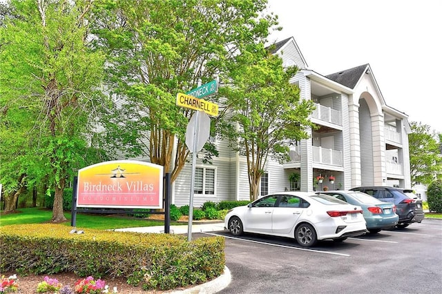 view of property featuring uncovered parking