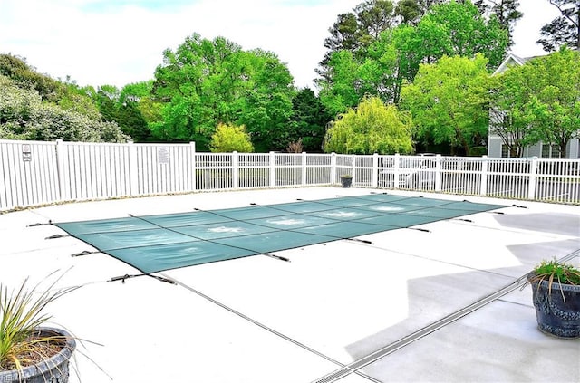 view of pool with a patio, a fenced in pool, and fence