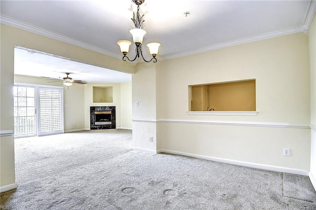 unfurnished living room with crown molding, baseboards, a high end fireplace, carpet floors, and ceiling fan with notable chandelier