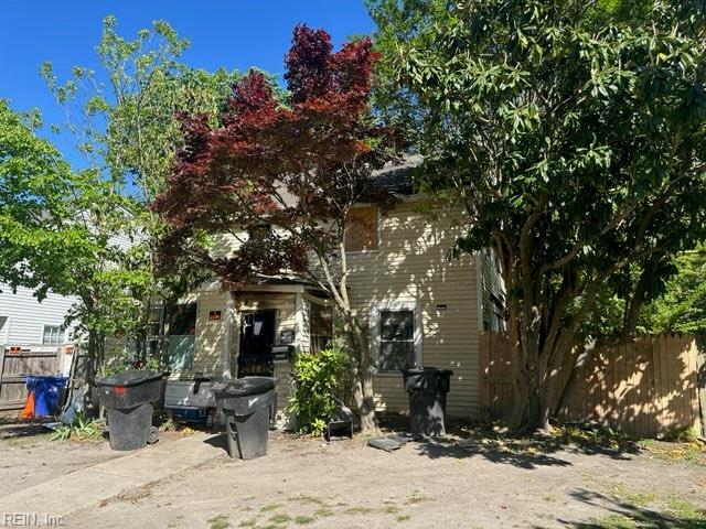 rear view of house with fence