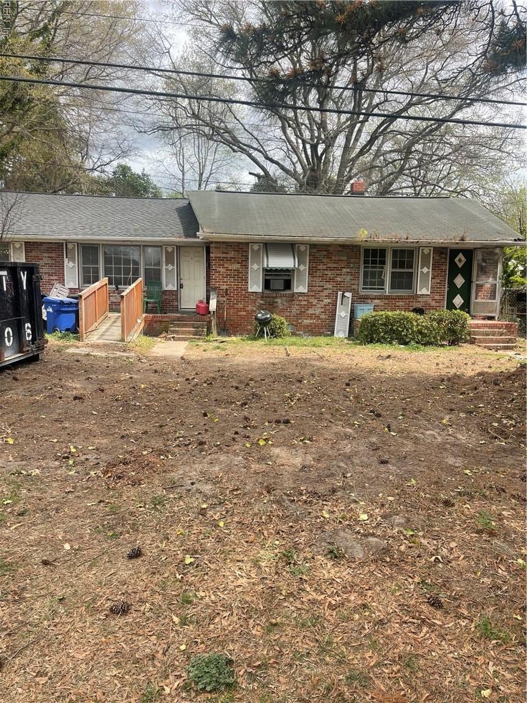 single story home with brick siding