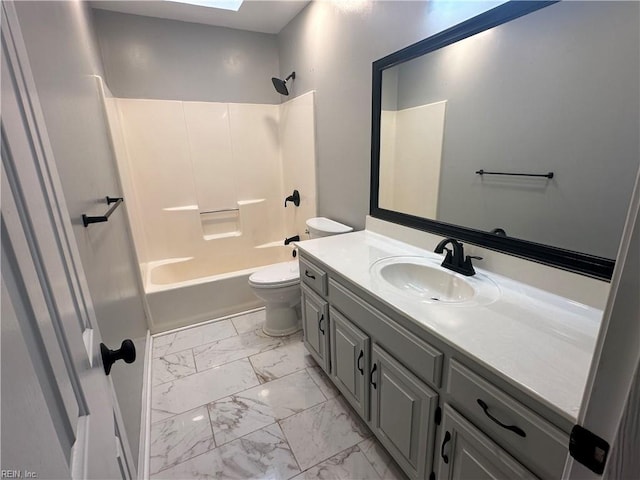 bathroom with toilet, marble finish floor, shower / washtub combination, and vanity
