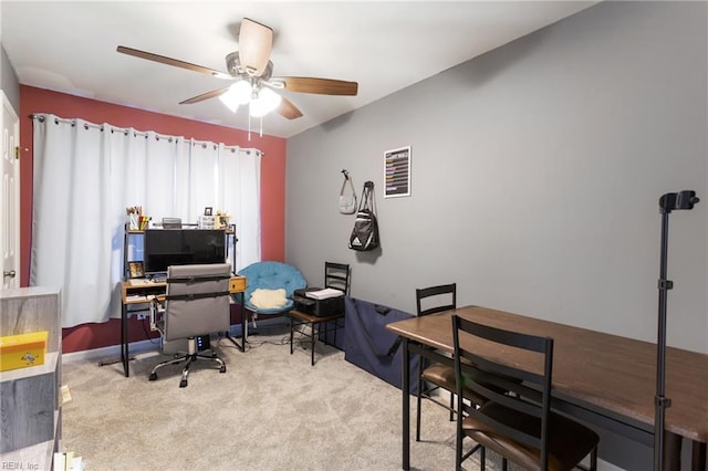 office area with carpet flooring, a ceiling fan, baseboards, and visible vents