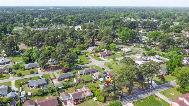 aerial view with a residential view and a wooded view