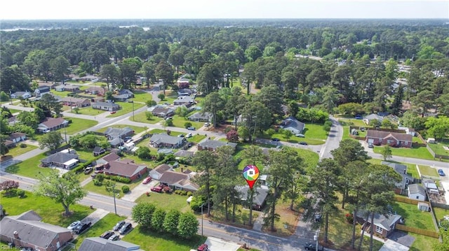aerial view with a residential view and a wooded view