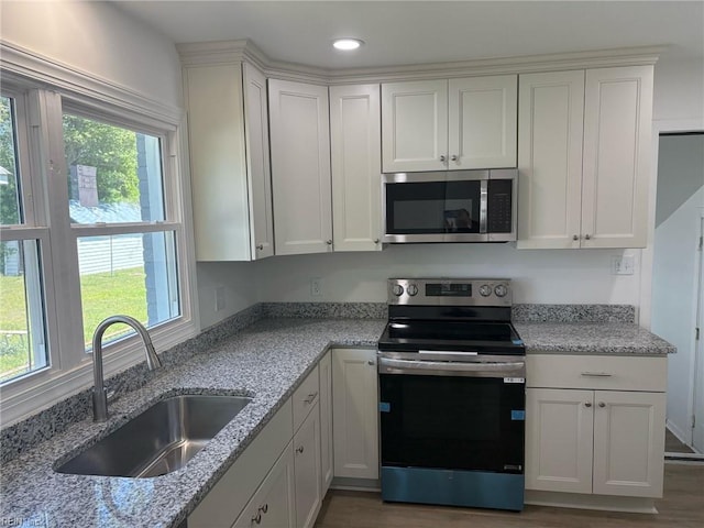 38 W Sherwood Ave, Hampton, VA 23663 - kitchen with white cabinetry, appliances with stainless steel finishes, and a sink