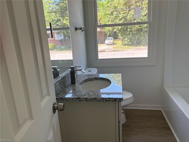 38 W Sherwood Ave, Hampton, VA 23663 - bathroom featuring baseboards, plenty of natural light, toilet, and vanity