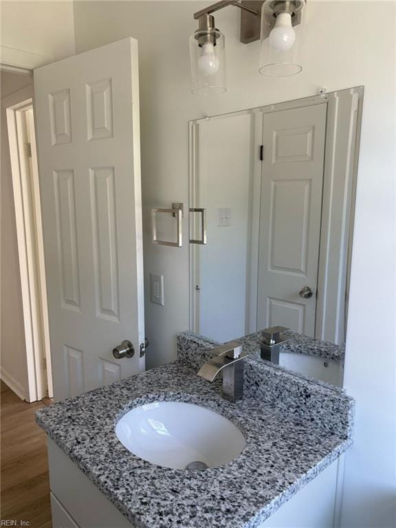 38 W Sherwood Ave, Hampton, VA 23663 - bathroom featuring wood finished floors and vanity