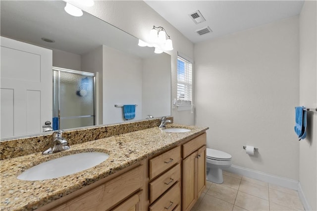 bathroom featuring toilet, baseboards, visible vents, and a sink