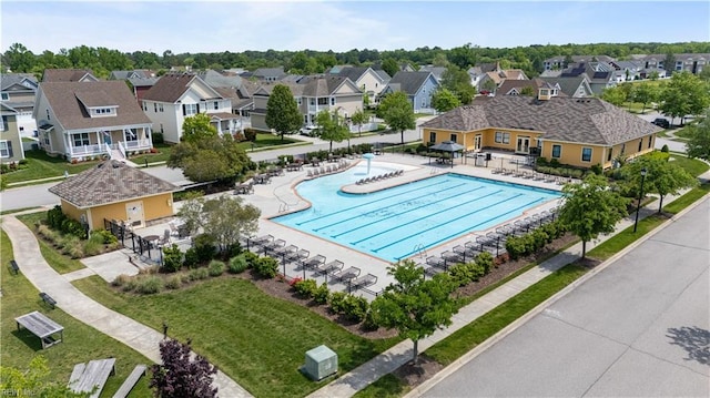 community pool with a residential view