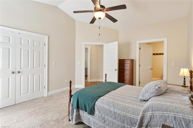 carpeted bedroom featuring baseboards, ceiling fan, lofted ceiling, and a closet
