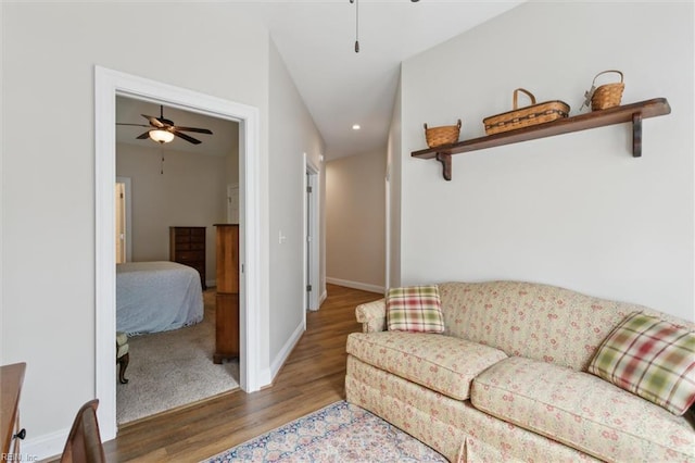 living room with baseboards, recessed lighting, ceiling fan, and wood finished floors