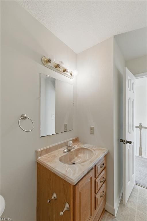 bathroom featuring vanity and baseboards