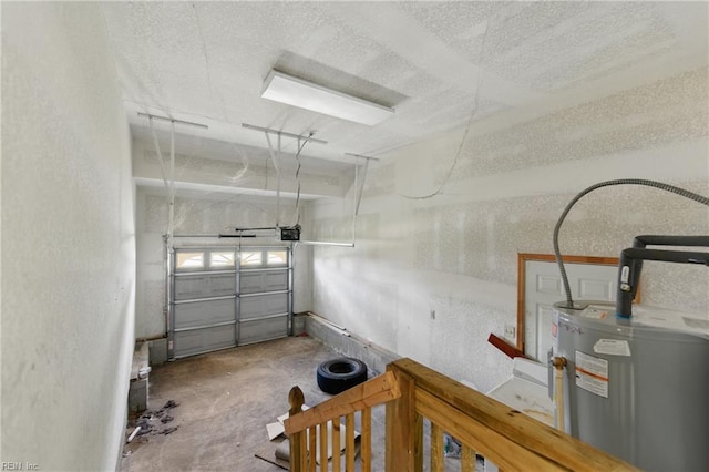 garage with a garage door opener and electric water heater