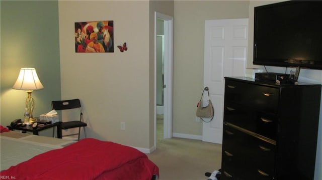 bedroom with baseboards and carpet flooring