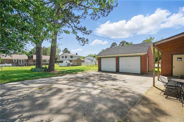 detached garage featuring fence