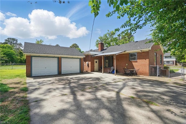 view of front facade featuring brick siding and fence