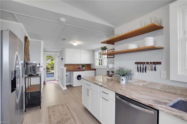 kitchen featuring open shelves, stainless steel appliances, light wood-style flooring, and white cabinetry