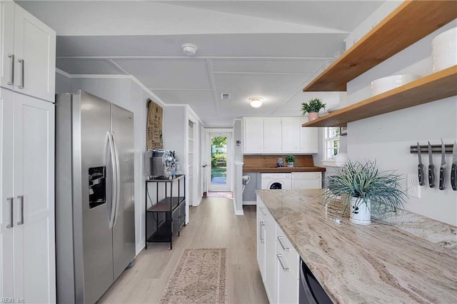 kitchen featuring white cabinets, open shelves, a wealth of natural light, light wood-type flooring, and stainless steel refrigerator with ice dispenser